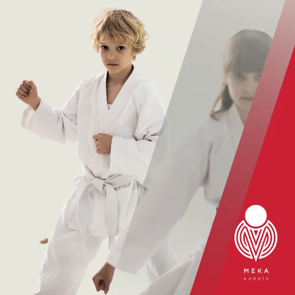 Young child learning karate with instructor